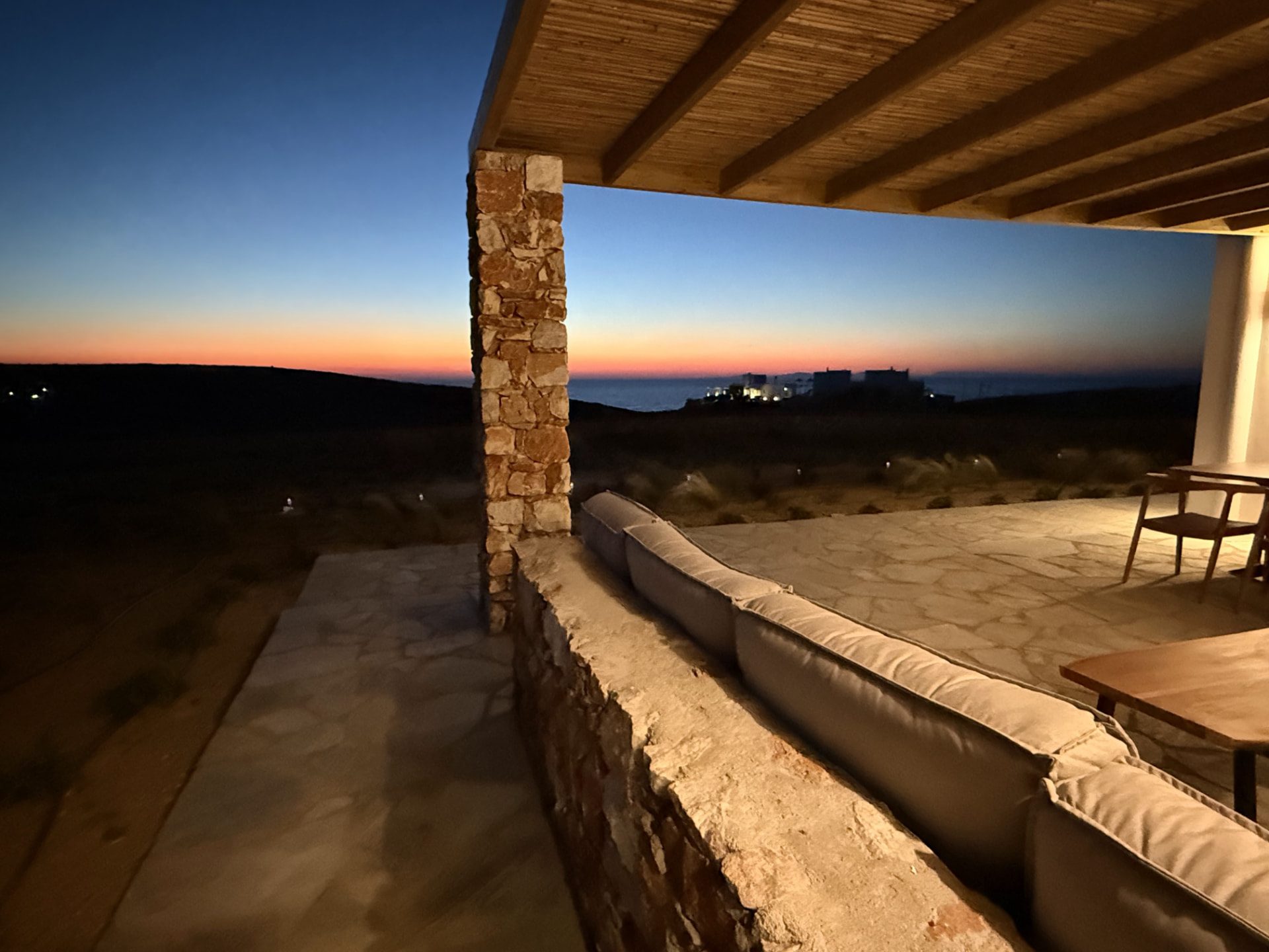 The covered terrace at DEON at dusk, the last light along the horizon